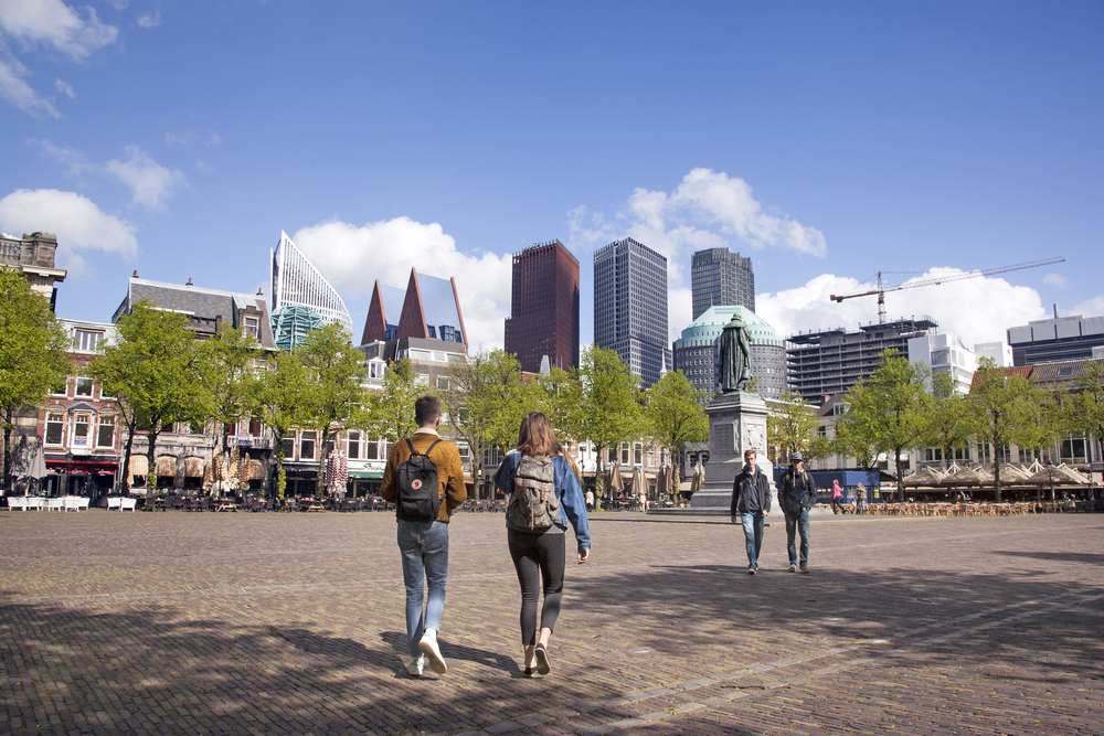 Young-couple-walking-on-Plein-in-the-Hague-Netherlands